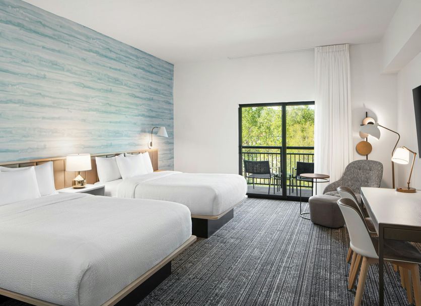 TownePlace Suites by Marriott Pigeon Forge guest room with two beds and a balcony view
