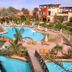 Rehana Sharm Resort in Sharm el-Sheikh with lagoon-style pools, palm trees and sun loungers