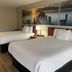 Days Inn by Wyndham Lake City I-10 room with two beds and lake pier artwork in Lake City