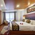 Hotel Shreesu Kathmandu guest room with king bed, brick accent wall and window seating