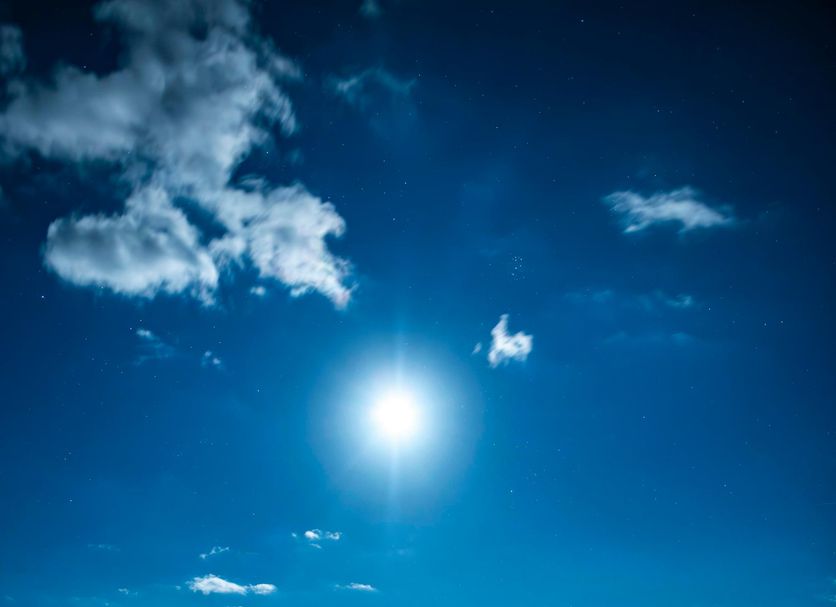 Towada Prince Hotel in Kosaka with a calm lake reflecting the bright sun under a blue sky