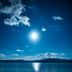 Towada Prince Hotel in Kosaka with a calm lake reflecting the bright sun under a blue sky