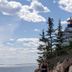 Moseley Cottage Inn and The Town Motel in Bar Harbor with a coastal lighthouse and ocean view
