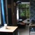 Chambre d'hôtes Au Nid du Thil guest room with bed, desk, and garden view in Beauvais