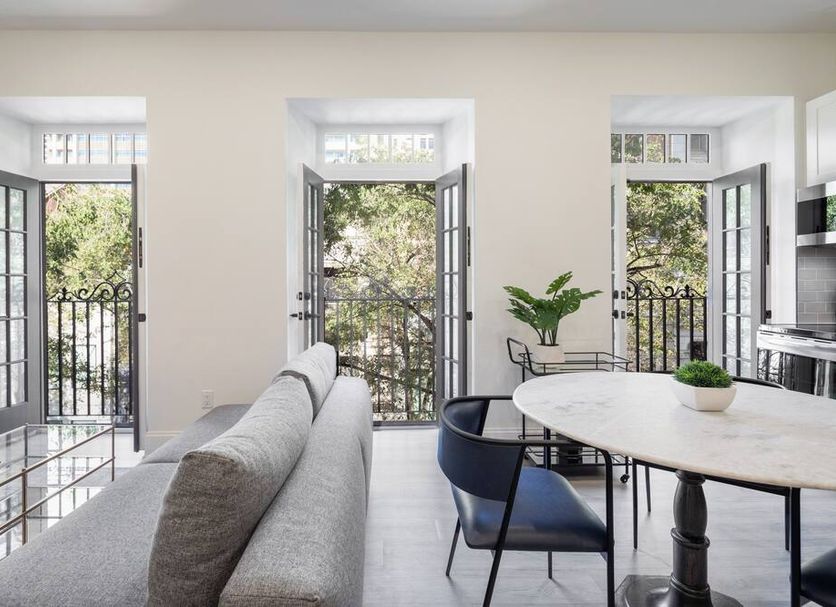 Sosuite at French Quarters - Rittenhouse Square in Philadelphia, bright room with French doors and tree views