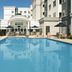 Residence Inn by Marriott Birmingham Hoover outdoor pool with lounge chairs and hotel building