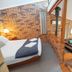 Blickinstal Holiday Retreat in Tanunda, loft bedroom with brick walls and separate sitting area