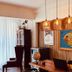 Boutique Hotel Casa Teatro in Manaus lobby with hanging lights, wood accents and colorful fish wall art