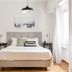 Central Cozy Apartments in Plaka by Upst Athens bedroom with queen bed, wood floors and window light