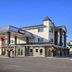 Ramada by Wyndham 100 Mile House exterior with lobby entrance and roadside sign in 100 Mile House