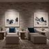 Loews Arlington Hotel lobby seating area with framed artwork and neutral lounge chairs in Arlington