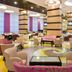Kfar Maccabiah Business & Sport Hotel lobby lounge in Ramat Gan with armchairs and tables