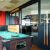 Bastion Hotel Zoetermeer game room with pool table, jukebox and bar area in Zoetermeer