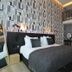 Valerius Boutique Hotel in Wormerveer: stylish loft-style guest room with mezzanine bed and modern decor