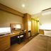 Business Hotel Cuore, Tsuruga: compact single room with bed, desk, chair, TV and air conditioner
