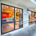 Motel 6 Mammoth Lakes exterior walkway with accessible ramp, office entrance, and blue room doors