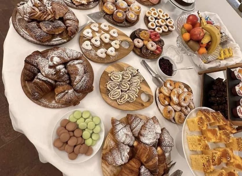 Bes Hotel Bergamo Cologno al Serio breakfast buffet with pastries, fruit, cookies and assorted desserts