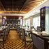 Chillax Resort Bangkok restaurant with set dining tables and warm ceiling lighting