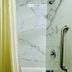 Quality Inn Sulphur - Lake Charles bathroom shower with marble-look tile and grab bar