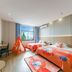 Zhoushan Dinghai New Donggang Hotel in Zhoushan room with two beds, teepee tent, and city view