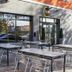 B&B Hotel Figueres outdoor terrace with tables and chairs outside the entrance in Figueres