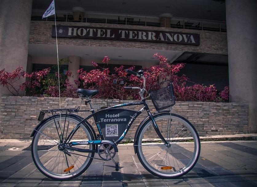 Hotel Terranova in Panama City entrance with bicycle and flower-lined facade