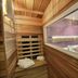 Vip Paris Yacht Hôtel & Spa sauna room with wood-paneled benches and interior window in Paris