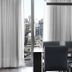 CH Recoleta Suites in Buenos Aires dining area with city view through tall windows