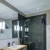 Goldener Adler Oberried bathroom with walk-in shower, wood vanity and towel storage