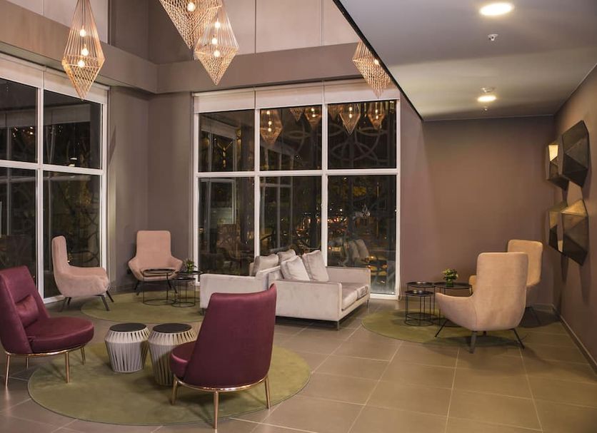 City Express Plus by Marriott Medellin Colombia lounge in Medellín with modern seating and large windows