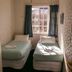 Kiwi's Nest Budget Accommodation & Backpackers in Dunedin: twin room with two single beds and window
