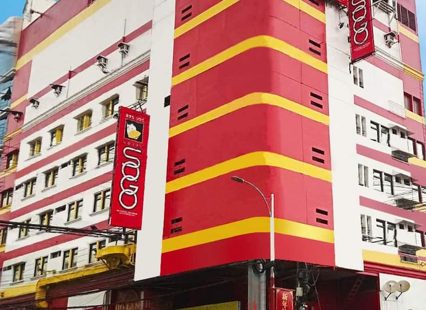 Hotel Sogo Banawe in Manila, pink and yellow hotel exterior with vertical signage
