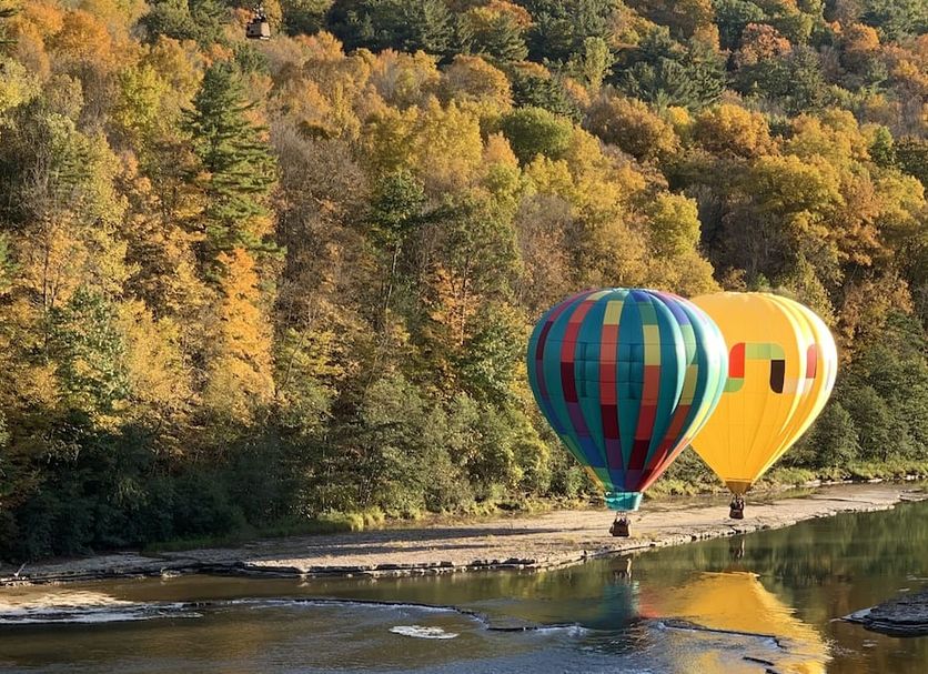 Hot air balloons over river by 1795 Acorn Inn Bed and Breakfast in Canandaigua
