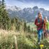 Hotel Niederreiter in Maria Alm am Steinernen Meer, hikers in alpine meadow with mountain views