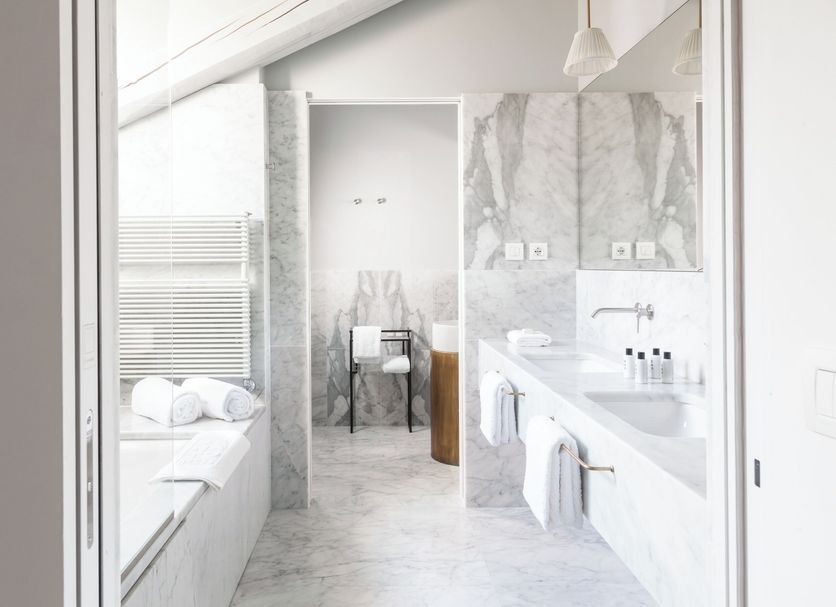 Senato Hotel Milano bathroom with double vanity, freestanding tub and marble finishes in Milan