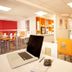 Premiere Classe Charleville Mezieres lobby with breakfast area and a laptop on a table in Charleville-Mézières