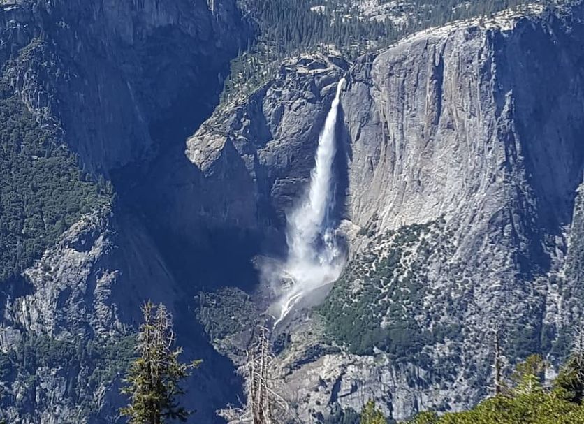 Nature's Inn Bed and Breakfast in Ahwahnee with a view of Yosemite Valley and a tall waterfall