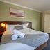 Hospitality Kalgoorlie, SureStay Collection by Best Western guest room with queen bed and en suite door