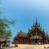 Serene Sands in Bang Lamung with a large ornate Thai temple-style building under a blue sky