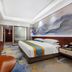 Anhui Construction New Era Hotel, Bengbu: guest room with king bed, wall-mounted TV and abstract mural