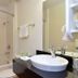 Motel 6 Twentynine Palms bathroom with shower-tub combo, sink, mirror and towel rack