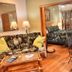 Maui What a Wonderful World Bed & Breakfast in Kīhei, cozy guest room with sofa, table, and bed