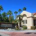 4 Seasons at Desert Breezes in Palm Desert with palm trees and resort entrance sign