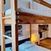Dorf.Apart in Neustift im Stubaital shows a cozy bunk bed loft with kitchenette and wood floors