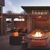 Hyatt House Emeryville/San Francisco Bay Area rooftop terrace with fire pit and seating at dusk