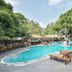 Villa Cha Cha Chaolao Beach Resort in Chanthaburi with outdoor pool and lounge chairs amid tropical trees