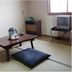 Date Business Hotel Castle room with low table, floor cushions, TV and window in Noboribetsu
