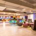 Aloft Panama lobby lounge in Panama City with colorful bar, seating area, and staircase