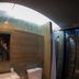 In a Box Hostel Bangkok bathroom with toilet, sink, shower and glass enclosure