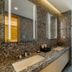 The Clouds Apartment in Shenzhen bathroom with double sinks, glass shower, and city view